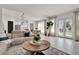 Open-concept living area with wood floors, and view of the kitchen and dining areas at 14366 Walcott Ave, Orlando, FL 32827