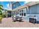 Backyard patio with outdoor seating and stainless steel grill at 14366 Walcott Ave, Orlando, FL 32827