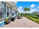 Paver patio with outdoor dining and a charming garden view, providing a perfect spot for relaxation and entertaining at 14366 Walcott Ave, Orlando, FL 32827