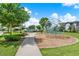 Community playground with modern climbing equipment and well-maintained landscaping on a sunny day at 14366 Walcott Ave, Orlando, FL 32827