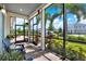 Relaxing screened porch with brick flooring, comfortable seating, and a lovely view of the backyard at 14366 Walcott Ave, Orlando, FL 32827