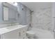 Renovated bathroom featuring marble tile, a modern vanity, and updated fixtures at 150 Wax Myrtle Woods Ct # 3D, Deltona, FL 32725