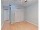 Cozy bedroom with light hardwood floors and a double door closet at 150 Wax Myrtle Woods Ct # 3D, Deltona, FL 32725