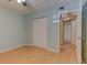 Comfortable bedroom with light hardwood floors and a closet at 150 Wax Myrtle Woods Ct # 3D, Deltona, FL 32725