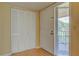 The condo entrance features bi-fold doors and a window providing abundant natural light at 150 Wax Myrtle Woods Ct # 3D, Deltona, FL 32725