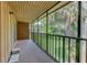 Relax on the screened lanai with views of lush landscaping, ideal for enjoying the outdoors at 150 Wax Myrtle Woods Ct # 3D, Deltona, FL 32725