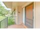 Cozy porch featuring a secure screen door and calming views of natural greenery at 150 Wax Myrtle Woods Ct # 3D, Deltona, FL 32725