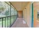 Relaxing screened porch showcasing outdoor living and views of the community surroundings at 150 Wax Myrtle Woods Ct # 3D, Deltona, FL 32725