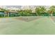 Enjoy a game of tennis on the community court surrounded by beautiful landscaping and residential buildings at 150 Wax Myrtle Woods Ct # 3D, Deltona, FL 32725