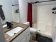 Bathroom with a wood countertop vanity, step stool, and shower/tub combo at 1501 Delaware Ave, St Cloud, FL 34769