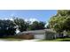 Charming single-story home featuring a two-car garage and a wooden privacy fence at 1501 Delaware Ave, St Cloud, FL 34769