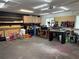 A garage featuring lots of work space, shelves and tools, and a tricycle set at 1501 Delaware Ave, St Cloud, FL 34769