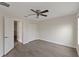 Cozy bedroom featuring hardwood floors, large closet, and white trim at 15229 Evergreen Oak Loop, Winter Garden, FL 34787