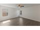 Bright bedroom features hardwood floors, large windows, and a ceiling fan at 15229 Evergreen Oak Loop, Winter Garden, FL 34787