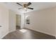 Bright bedroom with hardwood floors, a window and a closet with lots of shelving at 15229 Evergreen Oak Loop, Winter Garden, FL 34787