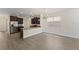 Open concept kitchen with granite counters, dark wood cabinets, and stainless steel appliances at 15229 Evergreen Oak Loop, Winter Garden, FL 34787