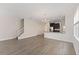 Bright open-concept living area and kitchen with hardwood floors and stylish chandelier at 15229 Evergreen Oak Loop, Winter Garden, FL 34787