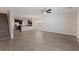 Spacious open-concept living room and kitchen with hardwood floors and modern light fixtures at 15229 Evergreen Oak Loop, Winter Garden, FL 34787