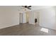 Spacious main bedroom featuring hardwood floors and ensuite bathroom at 15229 Evergreen Oak Loop, Winter Garden, FL 34787