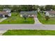 The aerial view of the front lawn and driveway of the home at 1591 Pendleton St, Deltona, FL 32725