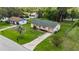 Charming home with a green lawn and driveway from above at 1591 Pendleton St, Deltona, FL 32725