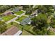 An aerial view highlights the home and surrounding neighborhood with its mature trees and adjacent homes at 1591 Pendleton St, Deltona, FL 32725