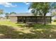 Outdoor area with a covered lanai, a picnic table and a barbecue grill at 1591 Pendleton St, Deltona, FL 32725