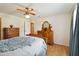 Bedroom featuring wood floors, a ceiling fan and wooden furniture at 1591 Pendleton St, Deltona, FL 32725