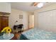 Bedroom featuring wood floors, ceiling fan, closet and desk space at 1591 Pendleton St, Deltona, FL 32725