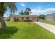 Charming single-story home featuring a well-manicured lawn and inviting curb appeal at 1591 Pendleton St, Deltona, FL 32725