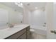 Well-lit bathroom featuring a shower-tub combination, tile floors, and vanity with quartz countertops at 1689 Greenleaf Woods Cv, Oviedo, FL 32765