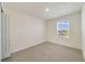 Cozy bedroom with plush carpet, ample natural light, and a modern design at 1689 Greenleaf Woods Cv, Oviedo, FL 32765