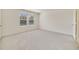 Bright, carpeted bedroom with natural light from the window and plenty of open space at 1689 Greenleaf Woods Cv, Oviedo, FL 32765