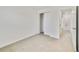 The bedroom is light and airy with neutral carpet and a white closet at 1689 Greenleaf Woods Cv, Oviedo, FL 32765