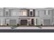Charming townhome featuring a brick and siding facade, garage, and well-manicured landscaping at 1689 Greenleaf Woods Cv, Oviedo, FL 32765