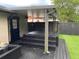 This backyard features a hot tub, lights, and patio area perfect for low-maintenance entertaining at 170 N Fairfax Ave, Winter Springs, FL 32708