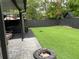 This backyard features a firepit, hot tub, patio and artificial turf perfect for low-maintenance entertaining at 170 N Fairfax Ave, Winter Springs, FL 32708