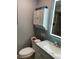 Updated bathroom with modern vanity, lighting, and medicine cabinet at 170 N Fairfax Ave, Winter Springs, FL 32708