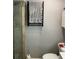 Modern bathroom featuring a black towel warmer and a glass door shower at 170 N Fairfax Ave, Winter Springs, FL 32708