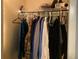 A closet with organized hanging clothes and a wire shelf at 170 N Fairfax Ave, Winter Springs, FL 32708