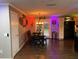 Open-concept dining room with dark hardwood floors, modern lighting, and a view of the backyard at 170 N Fairfax Ave, Winter Springs, FL 32708