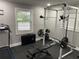 Home gym equipped with treadmill, weight rack, weight bench, and rubber flooring at 170 N Fairfax Ave, Winter Springs, FL 32708