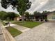 Charming home exterior with a brick paver driveway, mature trees, and welcoming front entrance at 170 N Fairfax Ave, Winter Springs, FL 32708