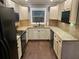 Spacious eat-in kitchen features stainless steel appliances, granite countertops, painted cabinets and a window at 170 N Fairfax Ave, Winter Springs, FL 32708
