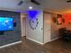 Open concept living room with modern decor, wood floors, and decorative wall at 170 N Fairfax Ave, Winter Springs, FL 32708