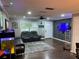 Open living room with hardwood floors, ceiling fan, neutral walls, and a front door at 170 N Fairfax Ave, Winter Springs, FL 32708