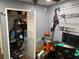 Office features gray walls and fishing poles mounted on the wall and closet at 170 N Fairfax Ave, Winter Springs, FL 32708