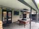 This patio features a covered billiards table, hot tub, exterior doors, lights and fans perfect for entertaining at 170 N Fairfax Ave, Winter Springs, FL 32708