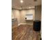 Spacious bonus room featuring wood floors, fan, and a window at 170 N Fairfax Ave, Winter Springs, FL 32708