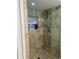Tiled stand up shower with glass doors and small window at 170 N Fairfax Ave, Winter Springs, FL 32708
